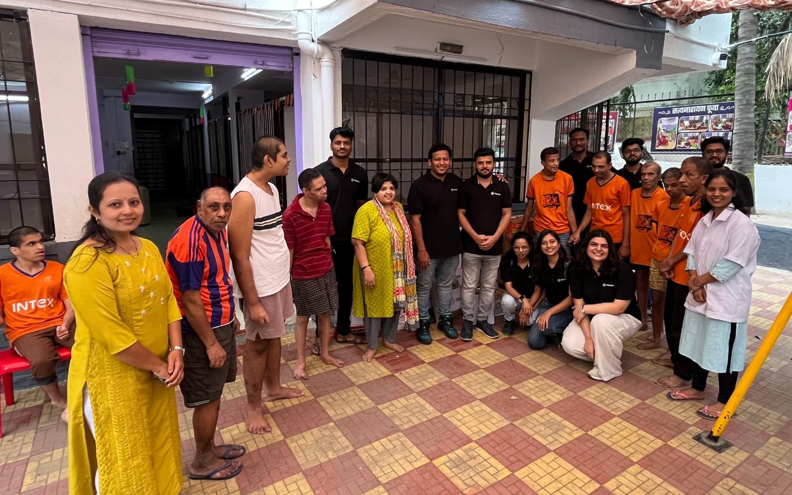 Flentas volunteers with residents during a CSR visit