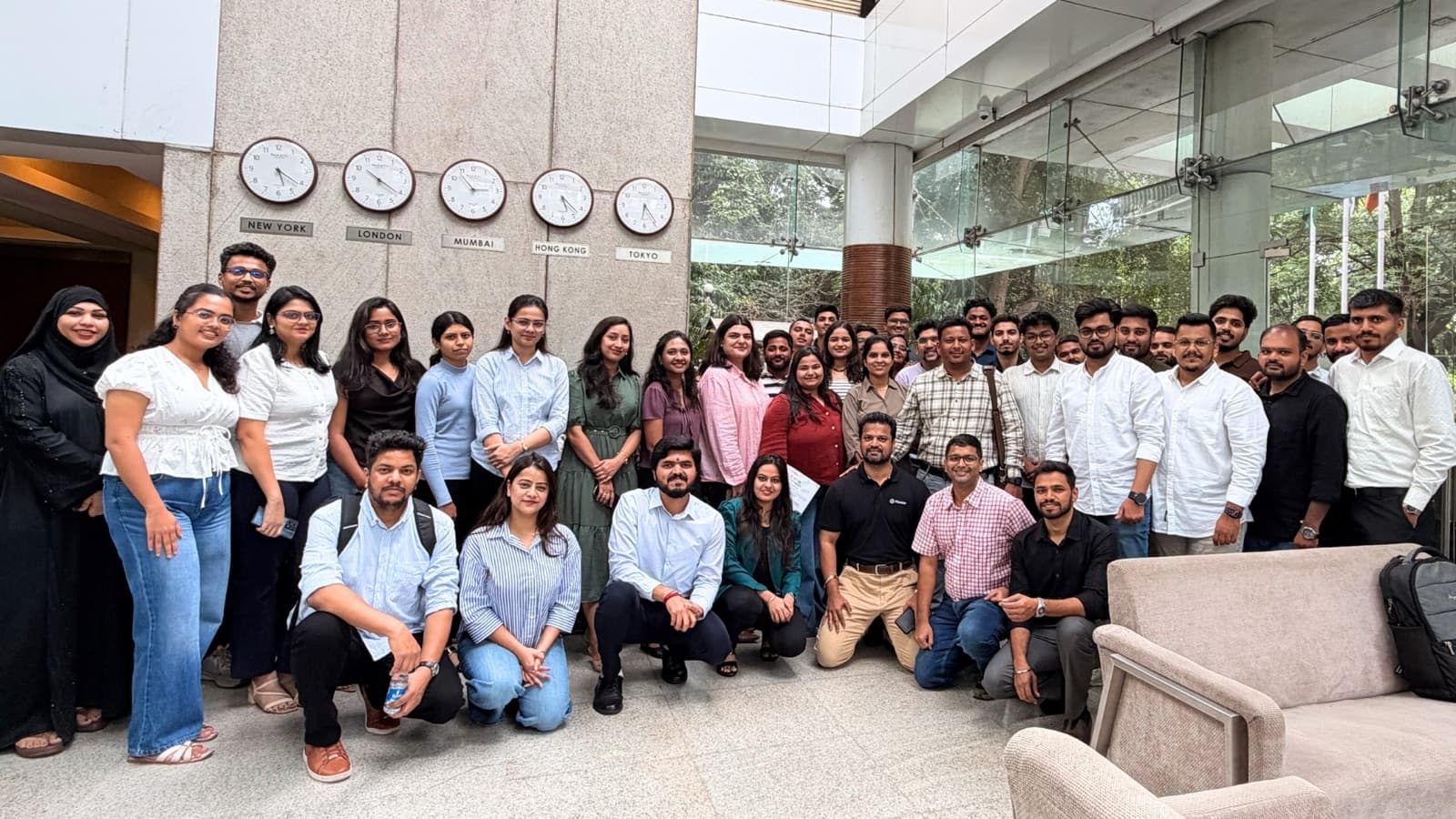 Flentas colleagues gathered in the office lobby