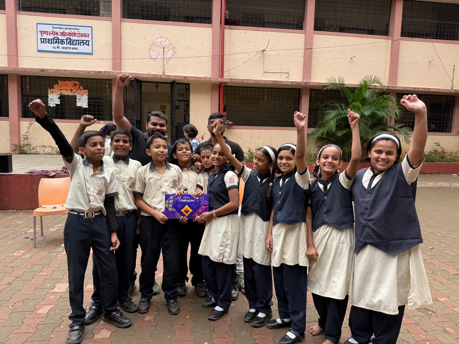 School children cheering during a Flentas CSR school visit